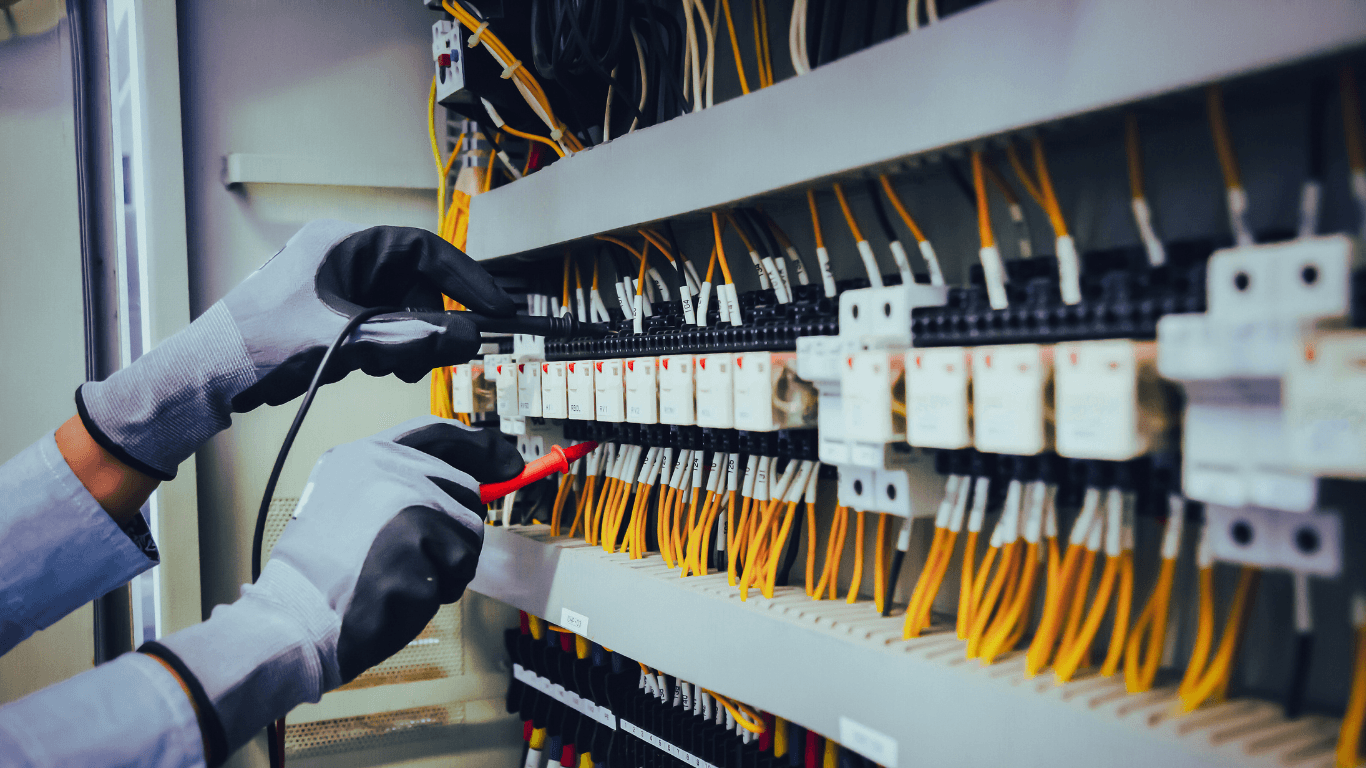 Electrician working on a distribution panel in Ireland